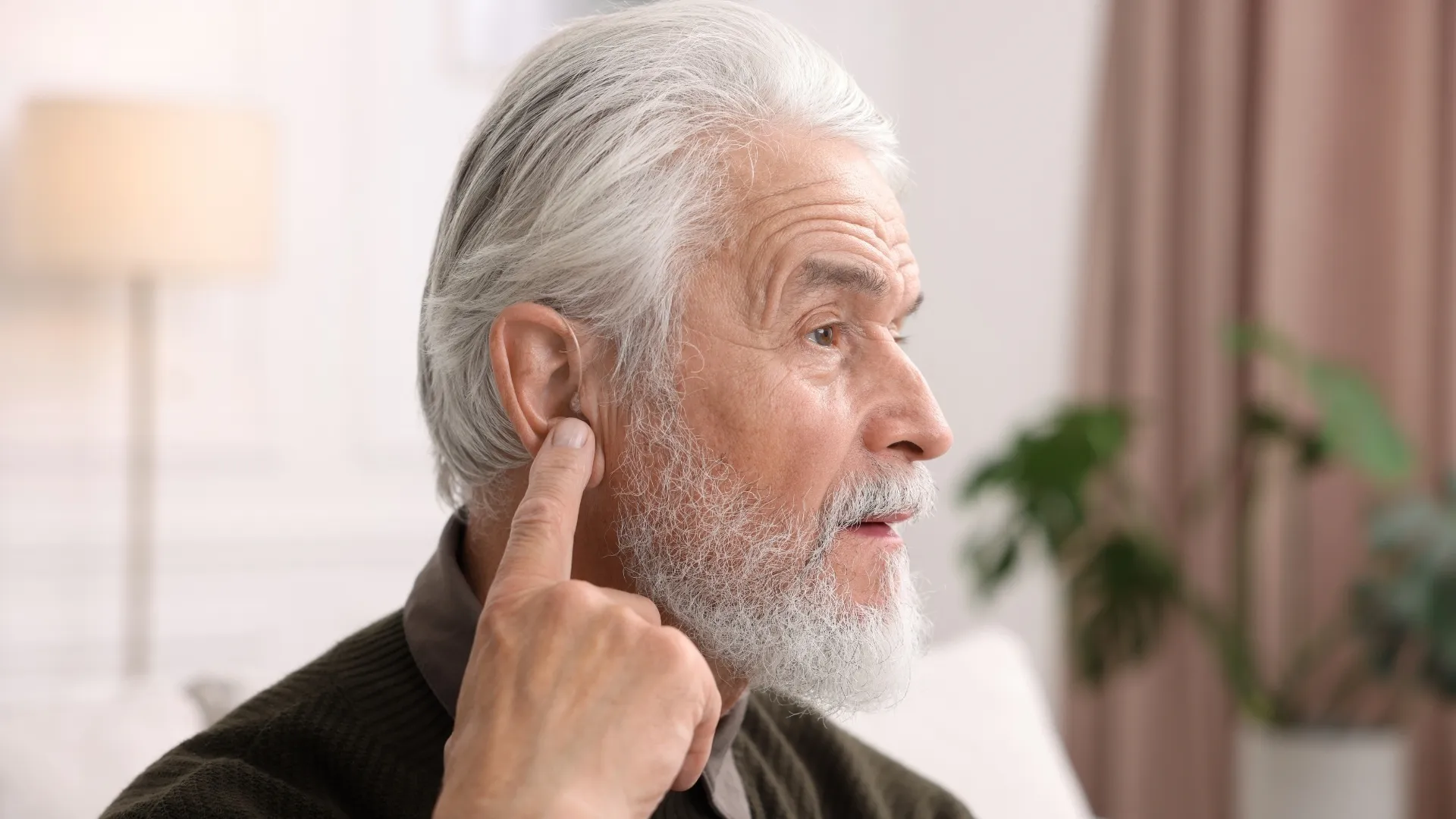 Learn what causes hearing aid feedback and how to reduce it through proper fit, cleaning, and professional care.