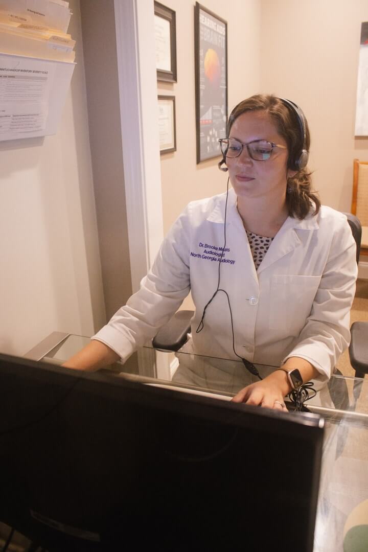 A audiologist conducting a Diagnostic Hearing Evaluation near Braselton GA
